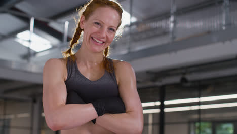 Portrait-Of-Smiling-Mature-Woman-Wearing-Fitness-Clothing-Standing-In-Gym-Ready-To-Exercise-3